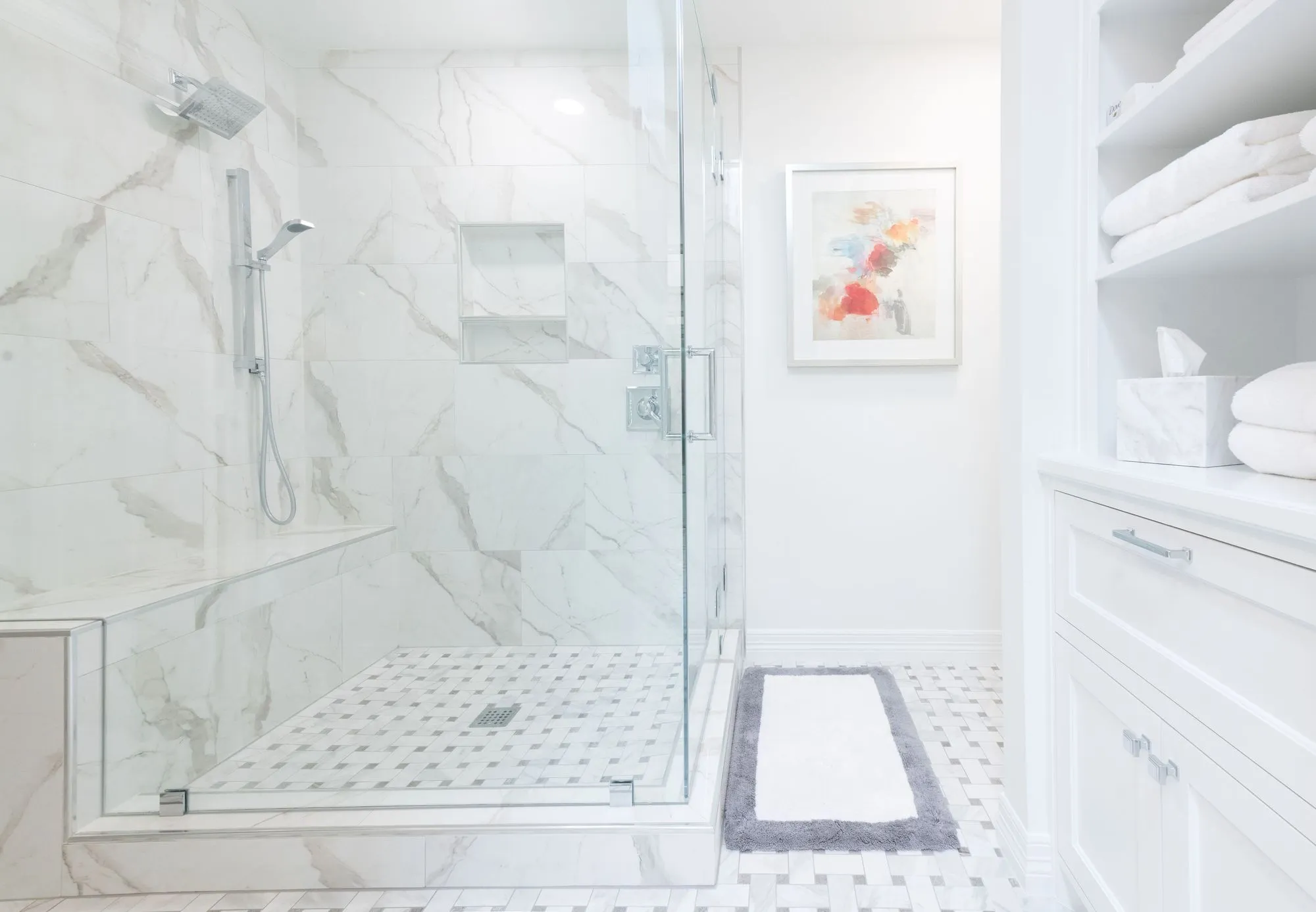Luxury bathroom renovation with custom glass shower and tile installation by BCT Contractors in Ontario.