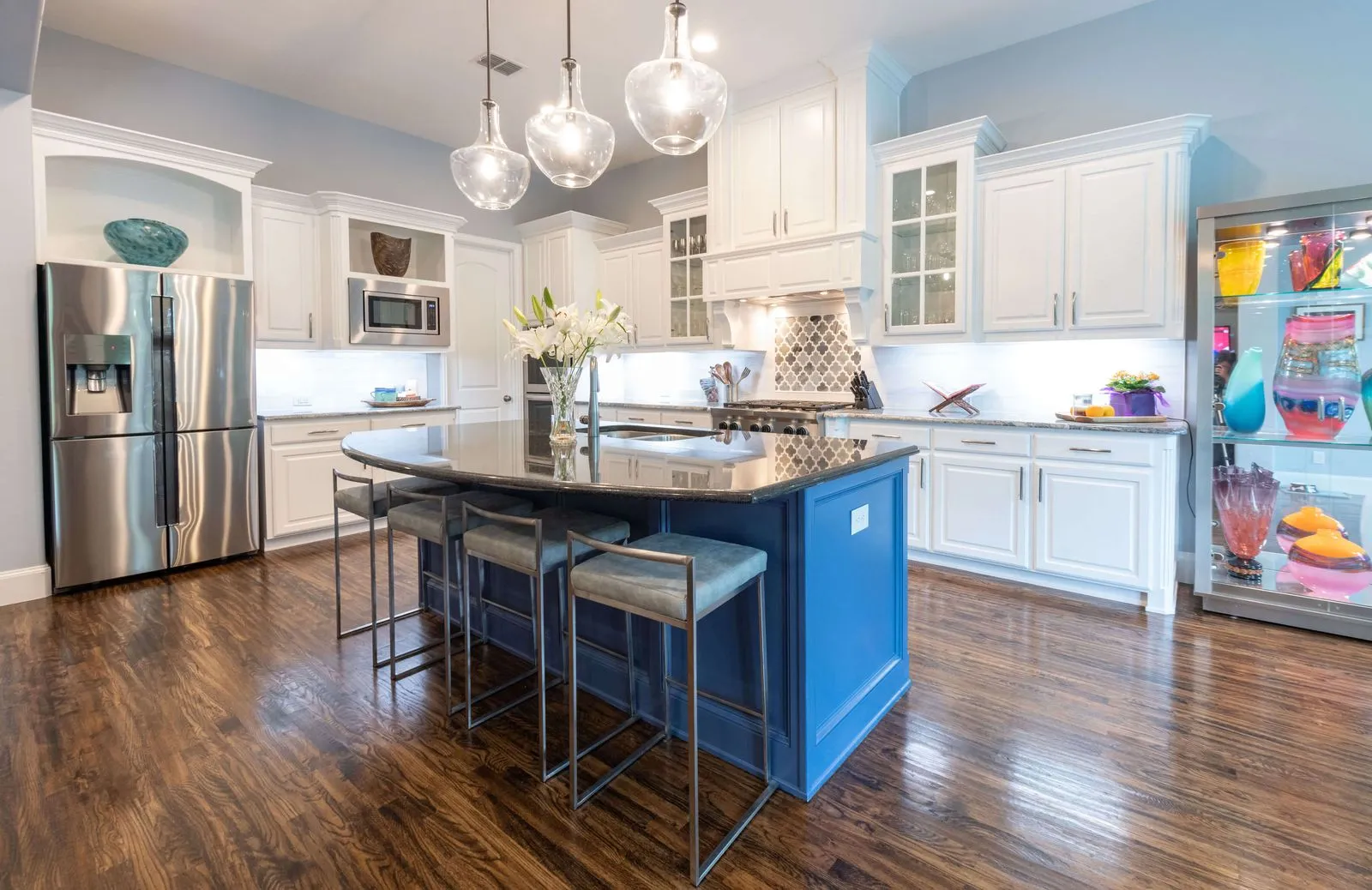 Modern kitchen renovation with custom cabinetry and quartz countertops by BCT Contractors.