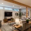 Modern renovated basement interior with stylish furniture and warm lighting
